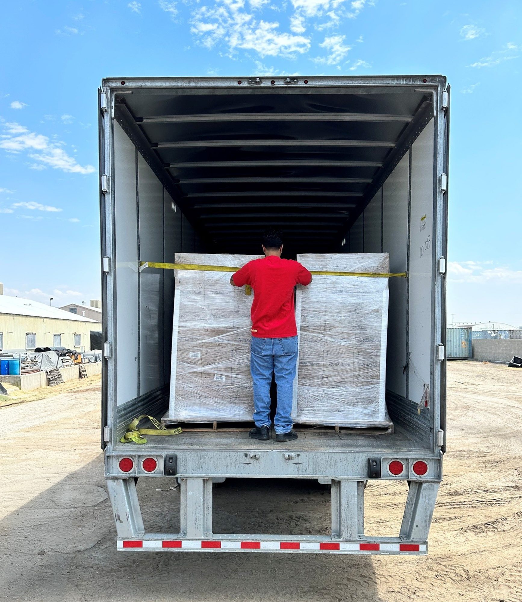 Palletised product being loaded into a trailer for distribution