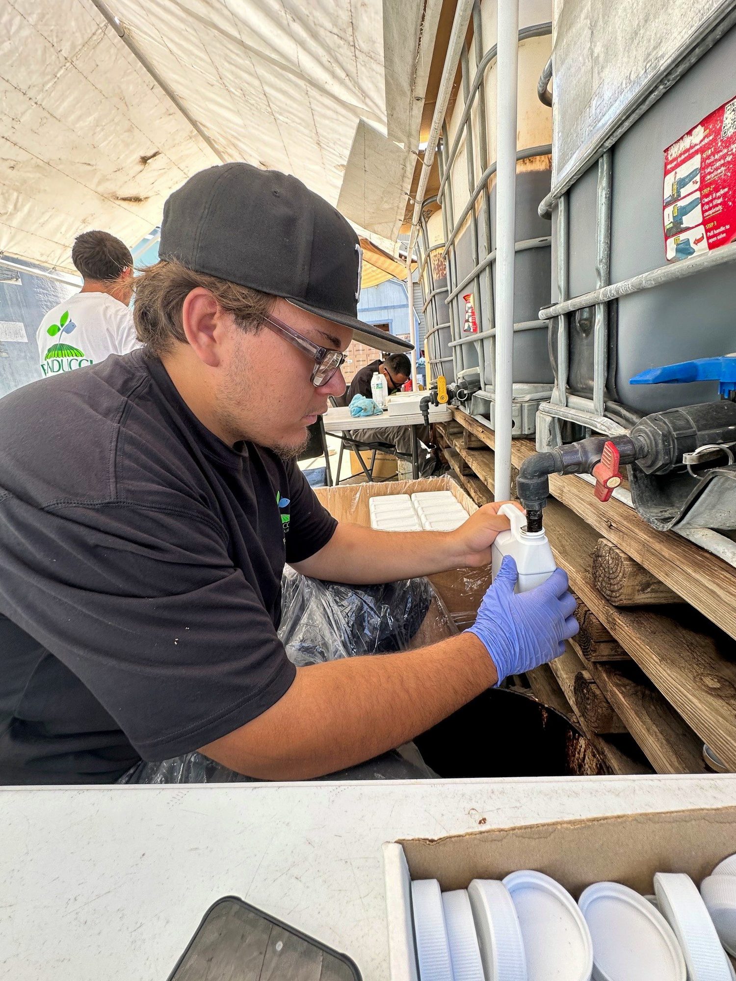 A BWF Banducci technician preparing a production lot sample for laboratory testing